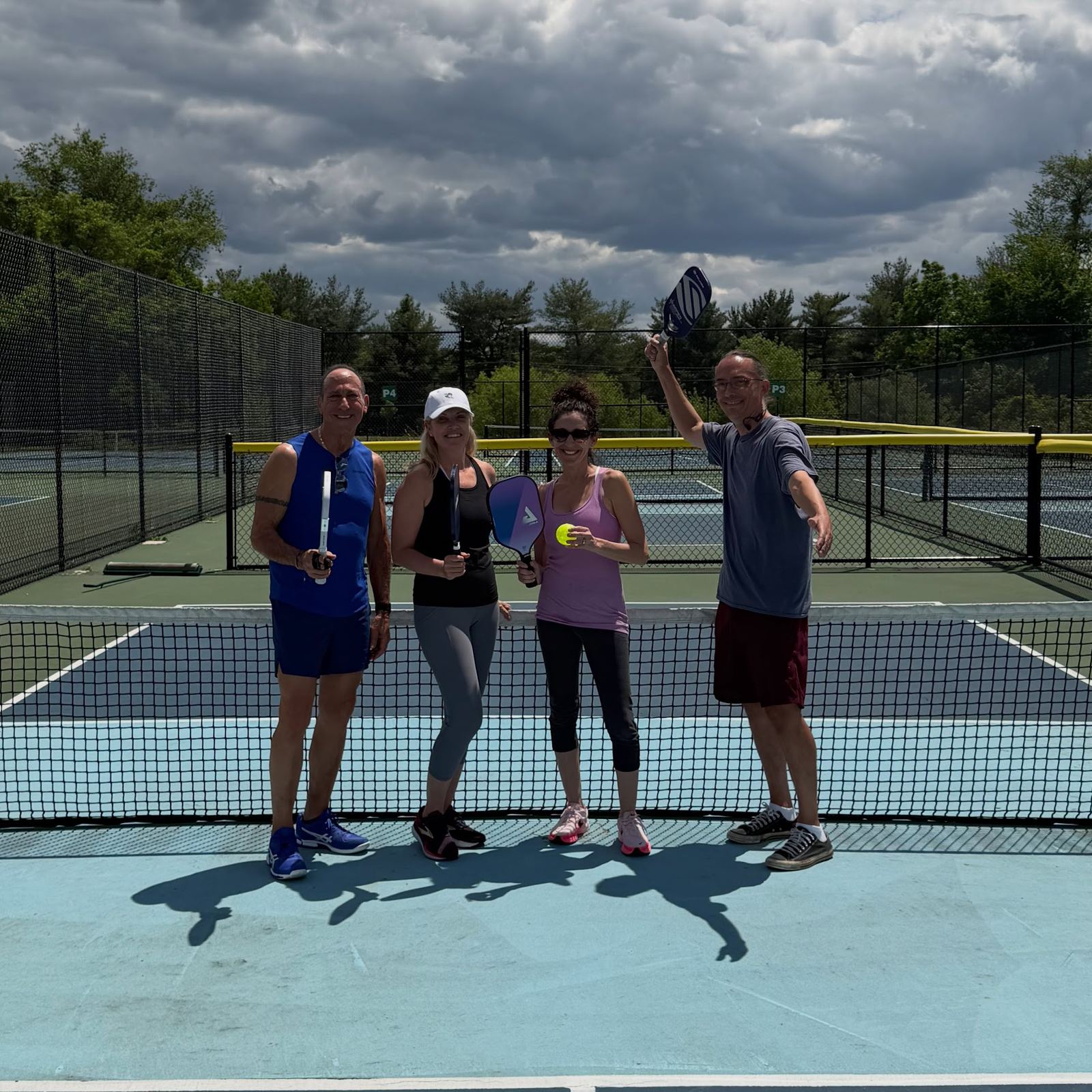 An adult pickleball clinic with Universal Rackets