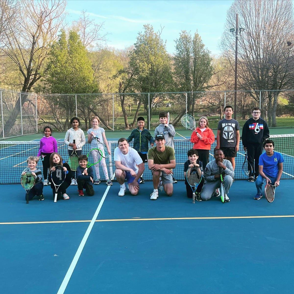 Junior tennis program on court